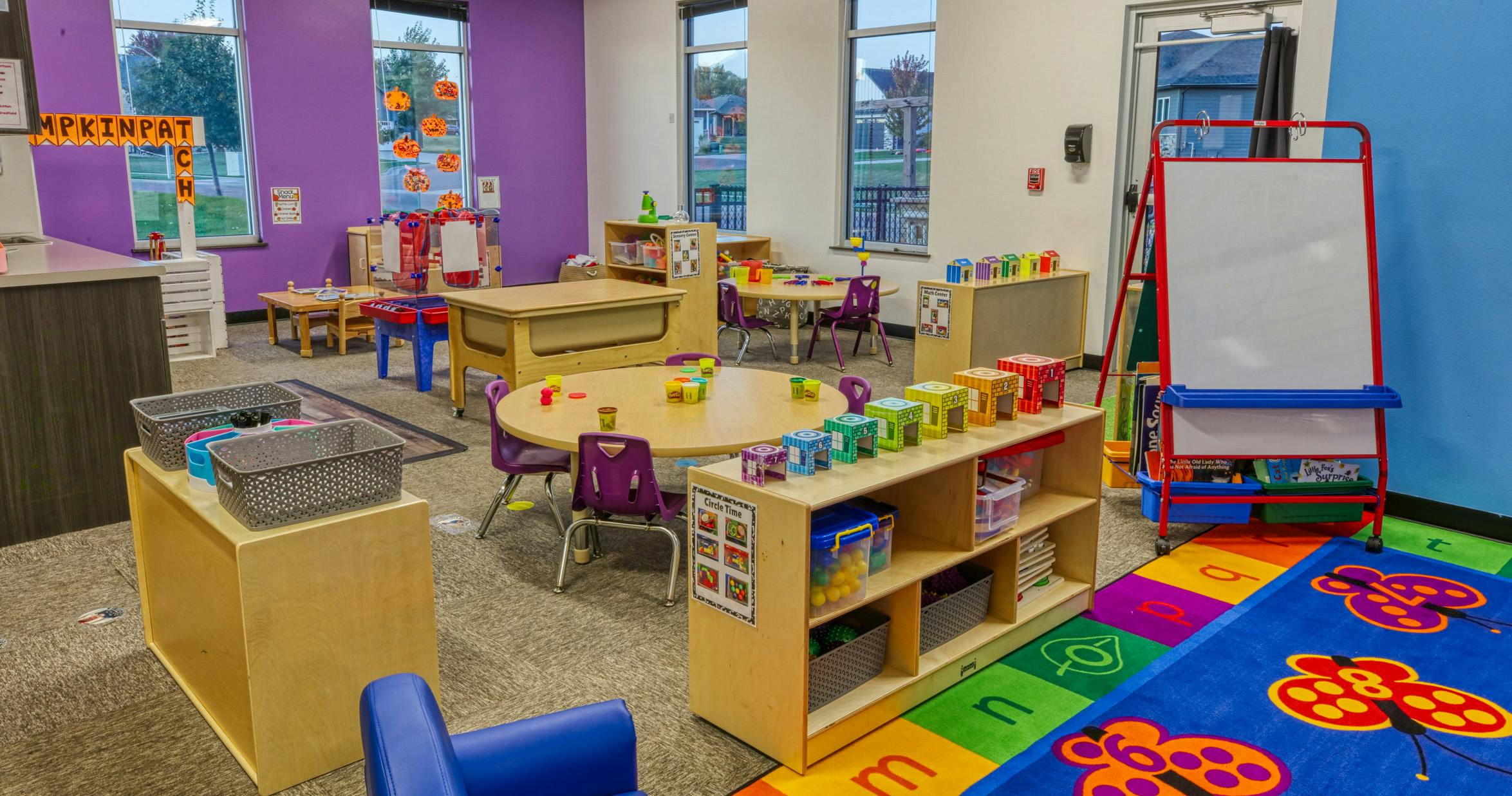 Classroom with child-sized furniture and colorful decor