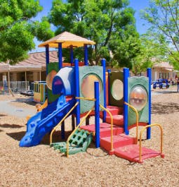 Playground structure with slides and climbing areas