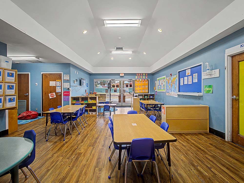 Empty classroom with tables and chairs