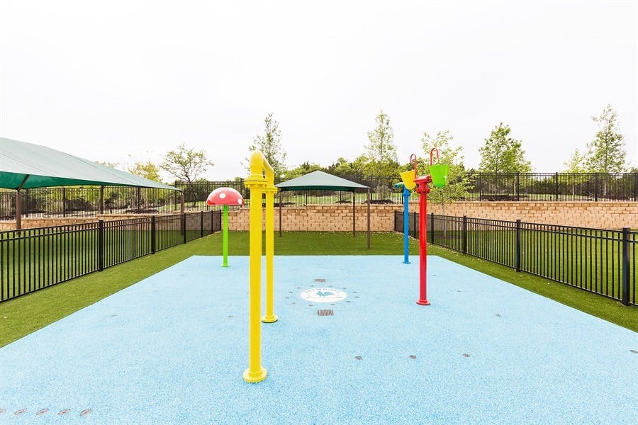 Water play area with colorful spray features