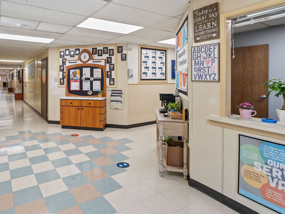Hallway with a bulletin board and a sign that says "Parent Center"