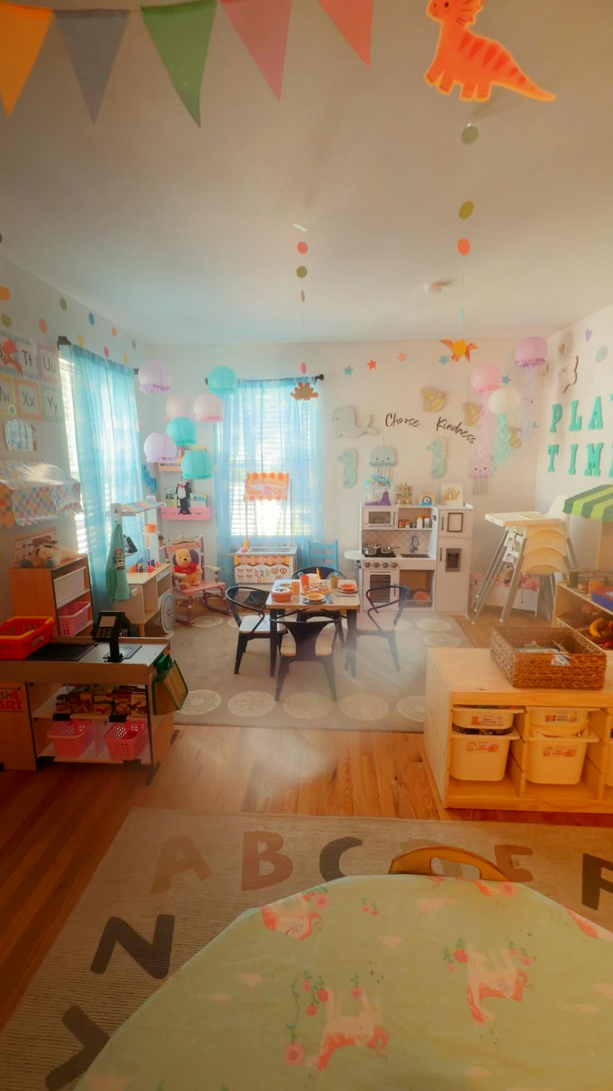 Playroom with children toy kitchen and dining set