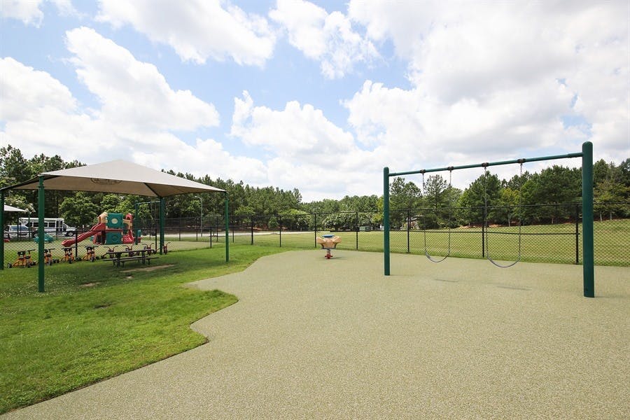 Playground with swings, slide, and covered picnic area