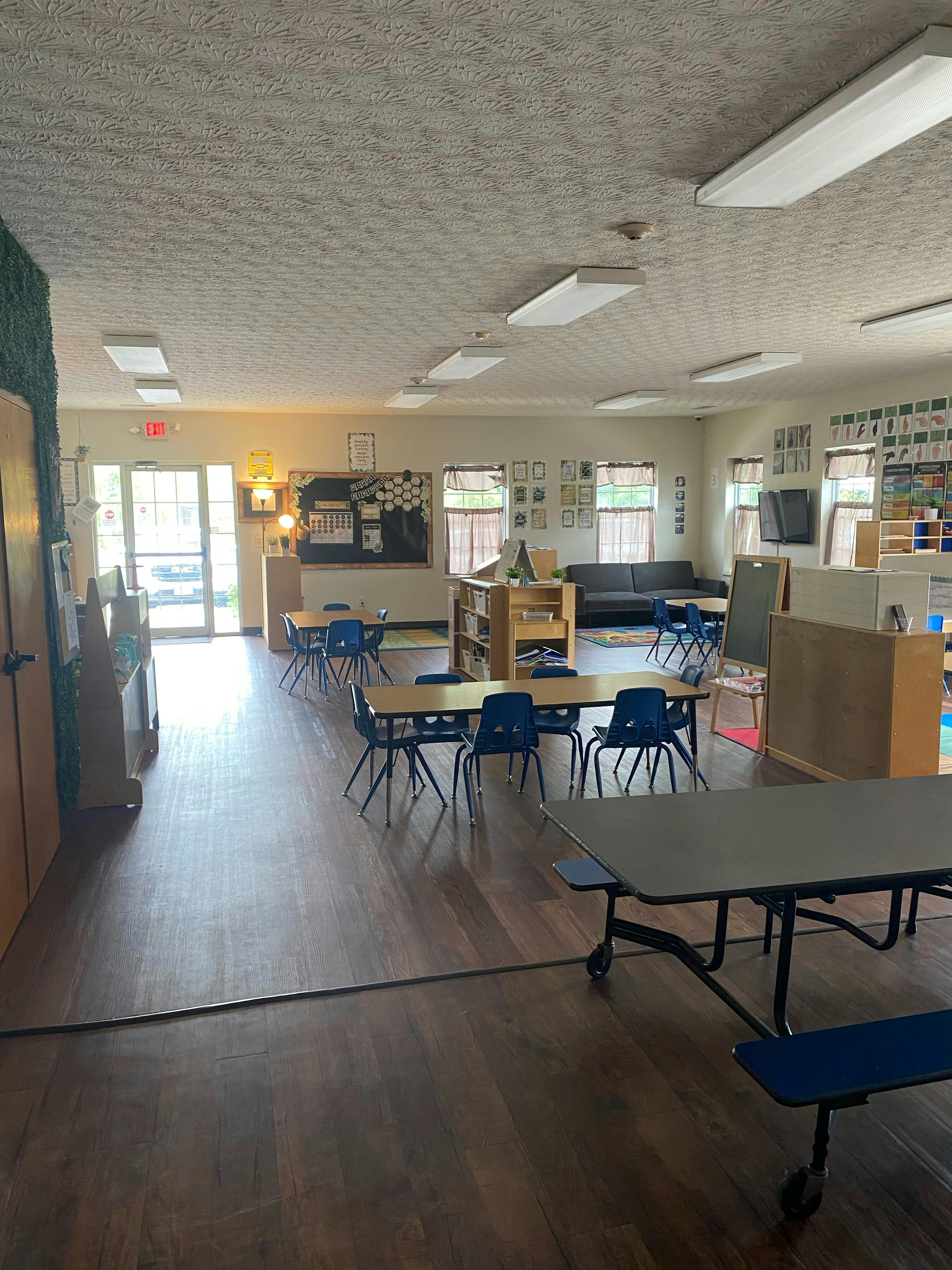 Empty classroom with tables and chairs
