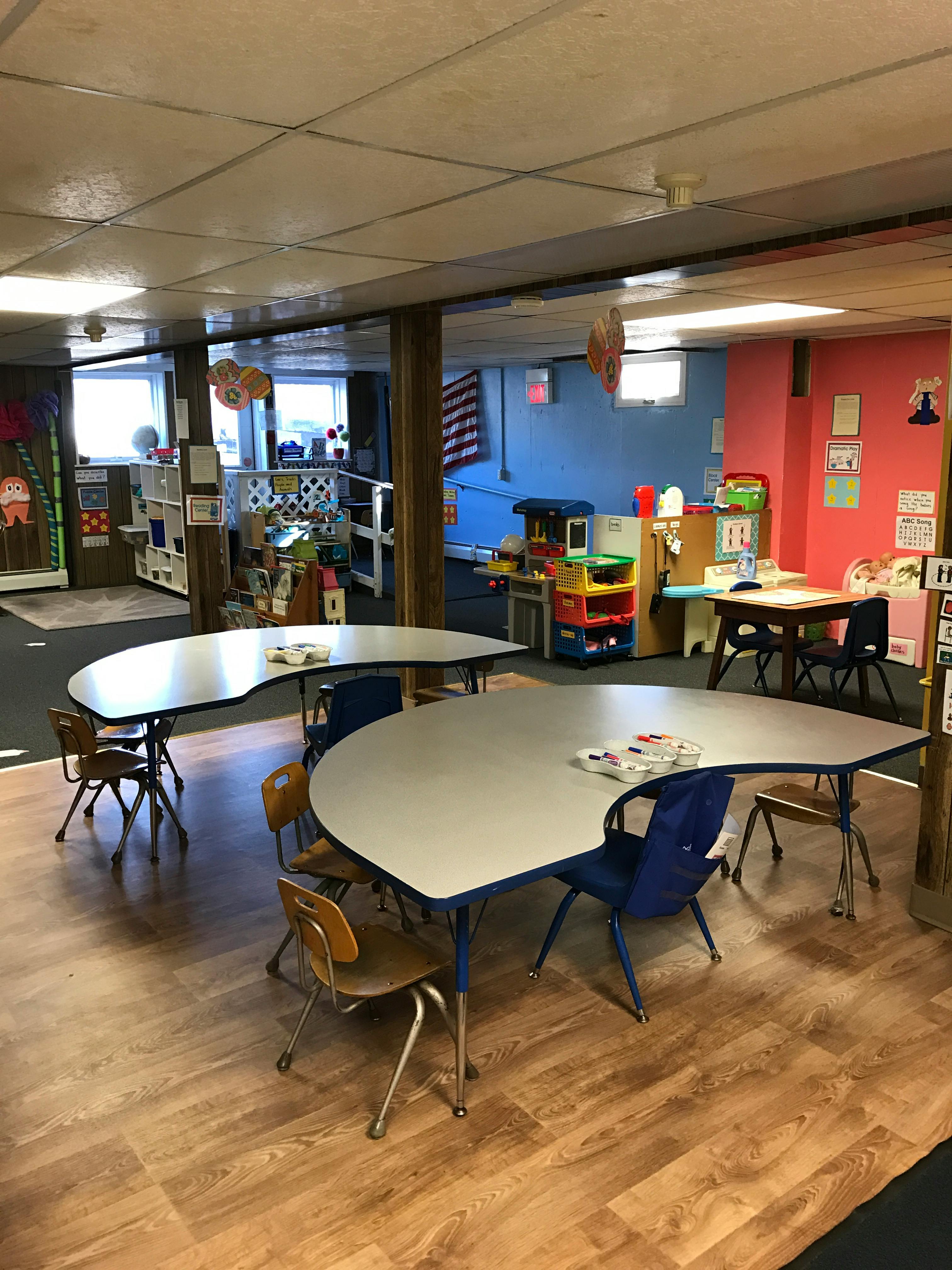 Classroom with multiple tables and chairs