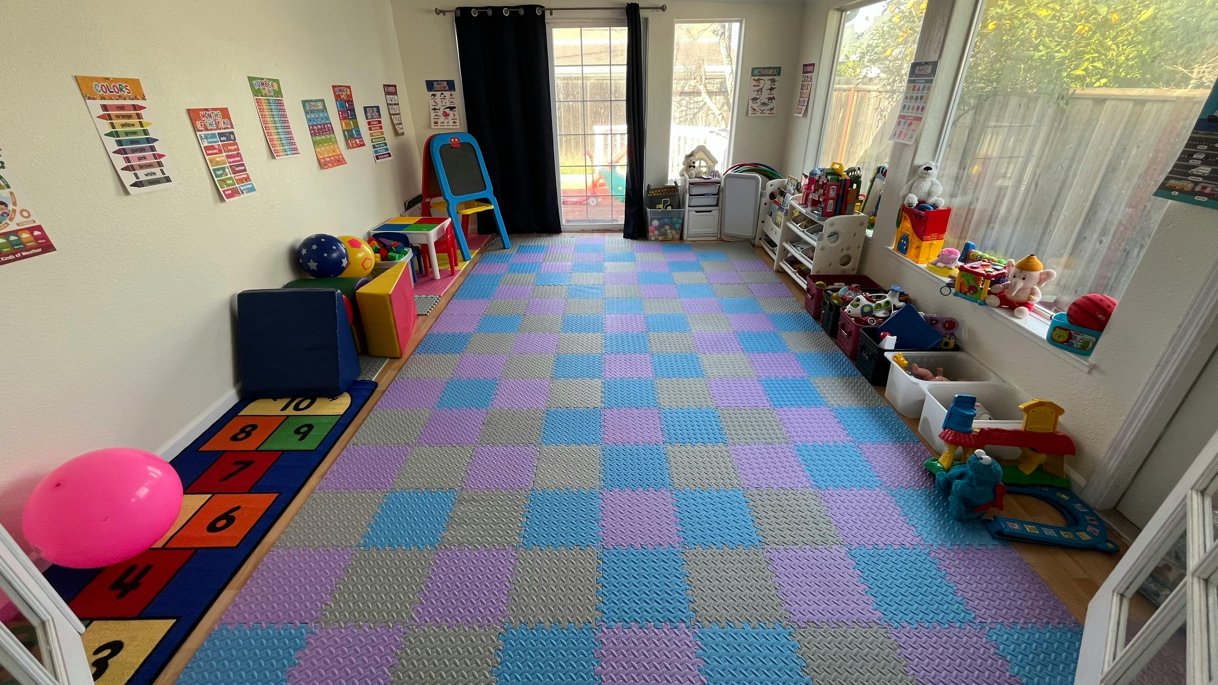 Playroom with checkered floor mats and toys