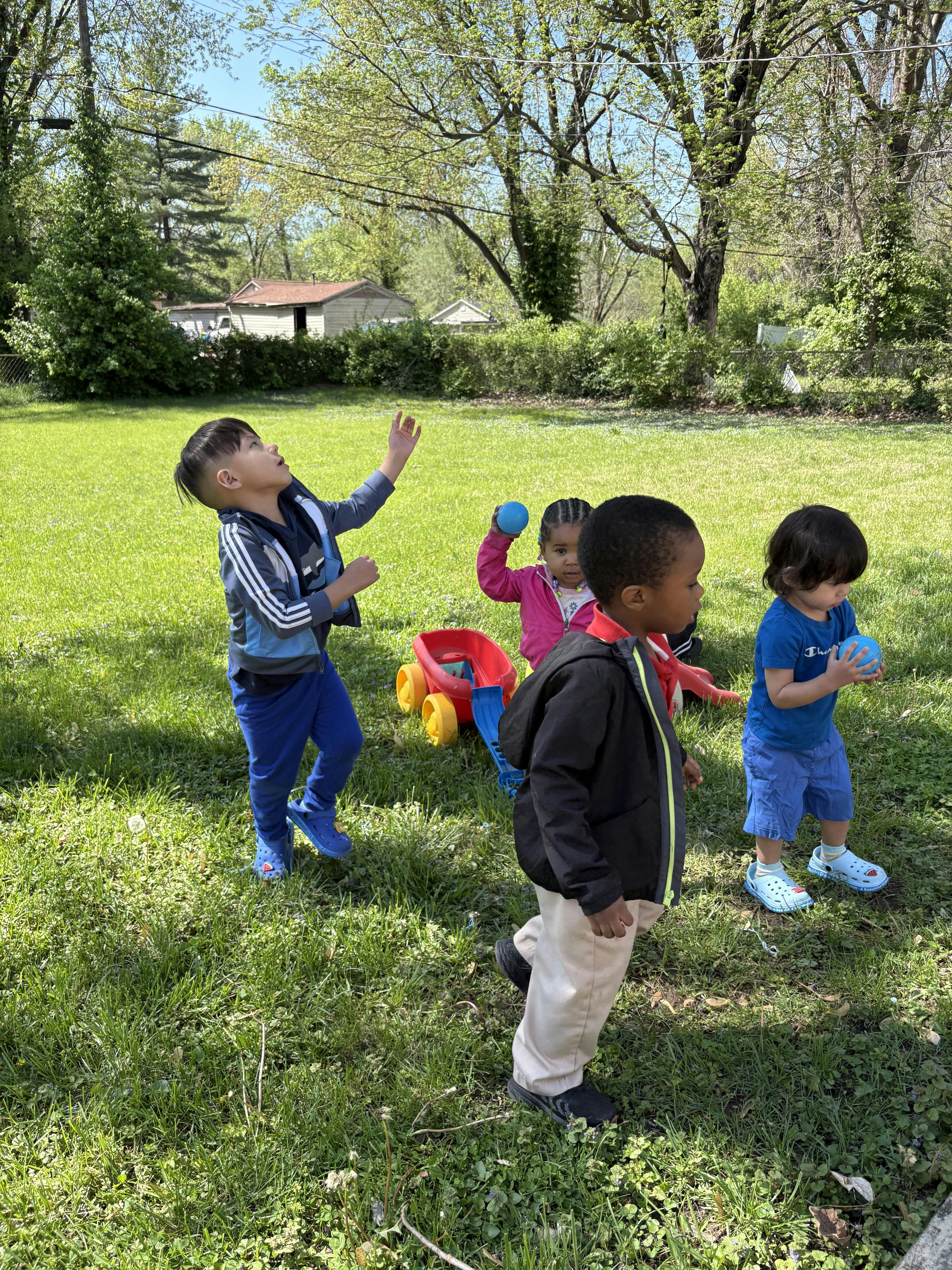 Children playing with balls outdoors