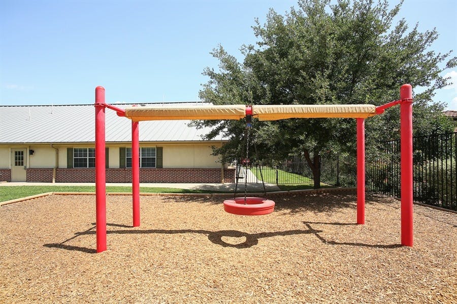 Playground swing set with a tire swing