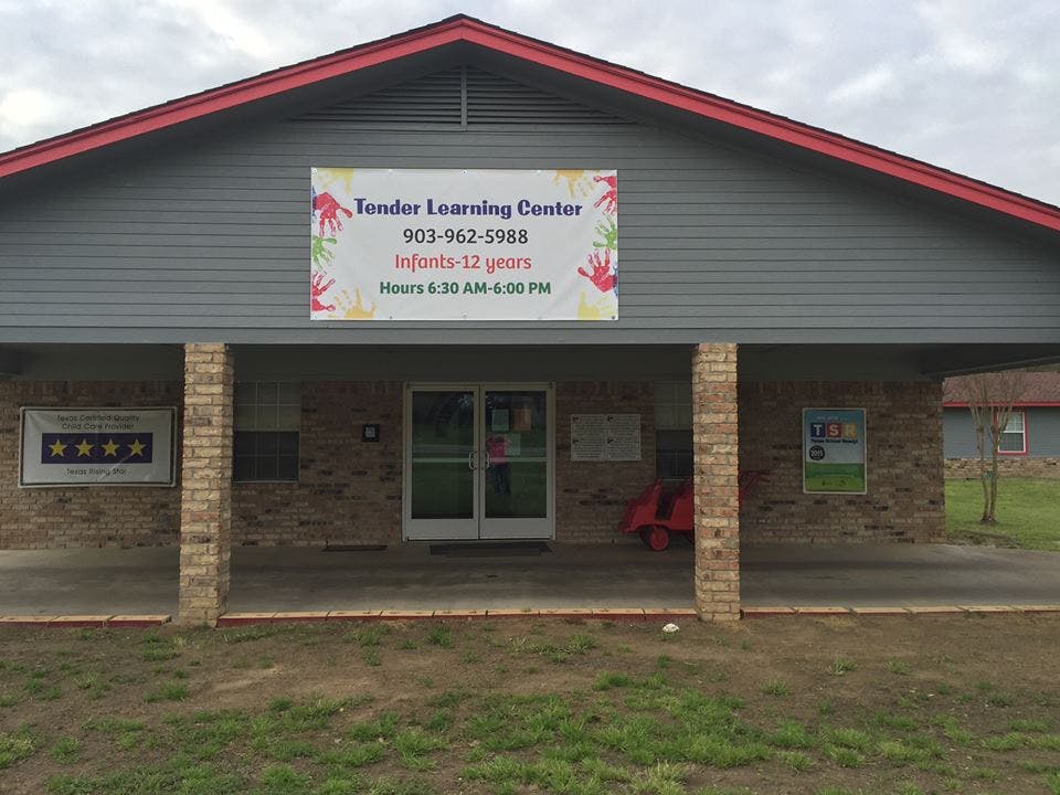 Building with a sign that reads "Tender Learning Center"