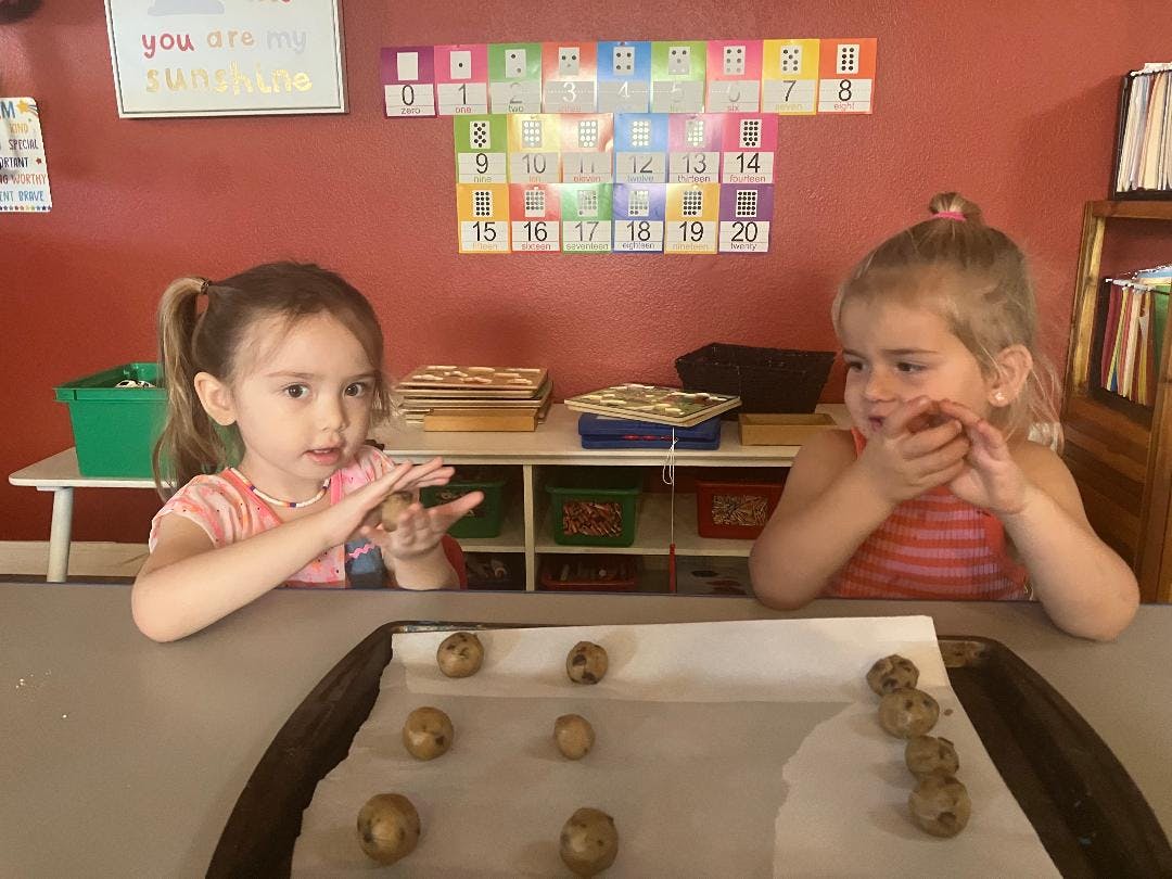 Two children making cookies