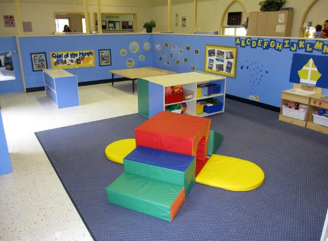 Colorful soft play climbing structure in a classroom