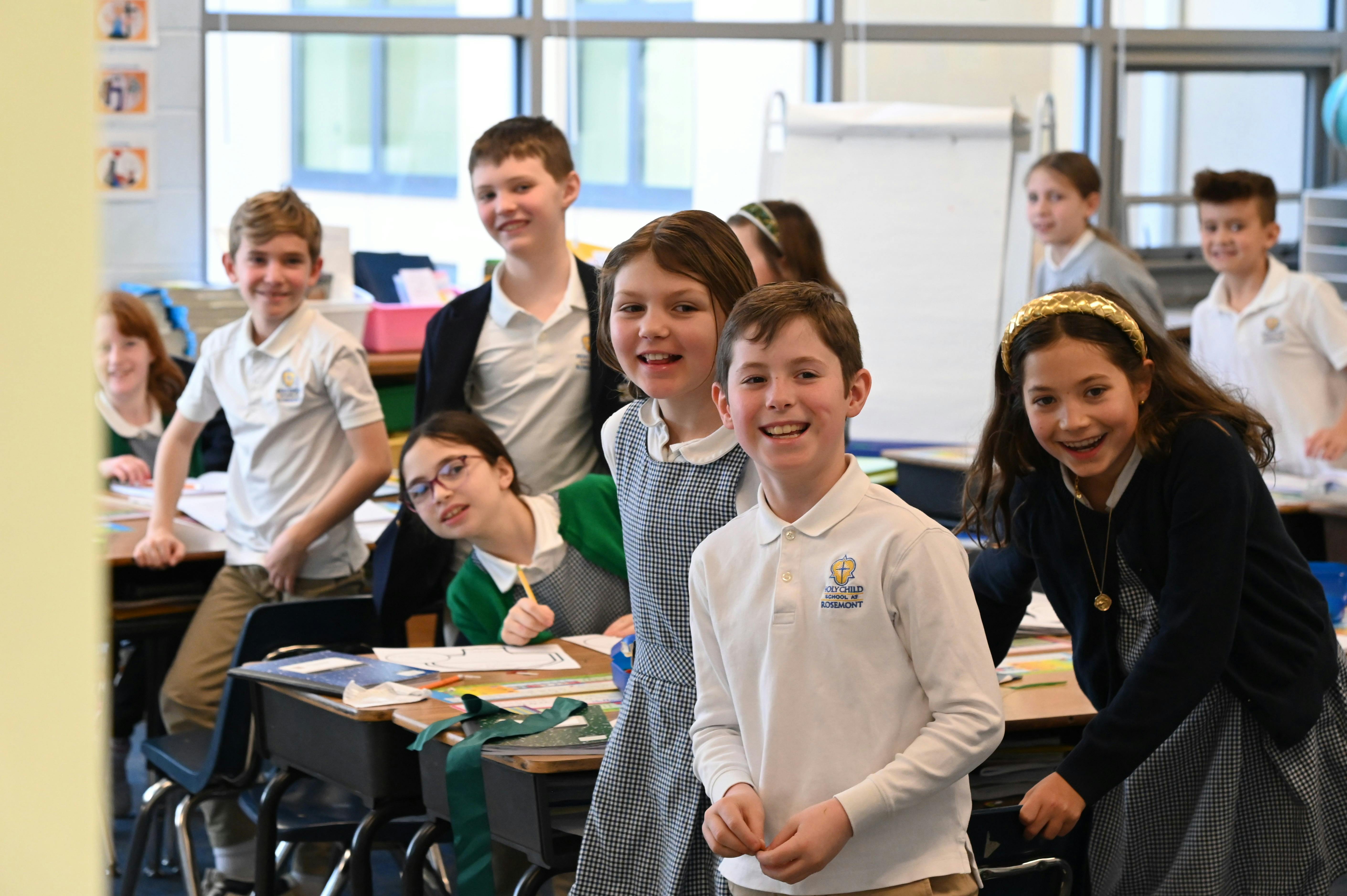 Group of children in school uniforms in a classroom