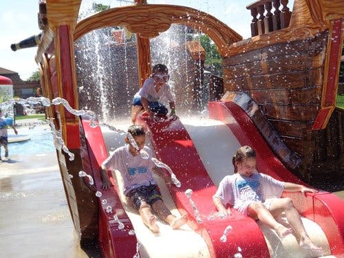 Children on water slides at a water park