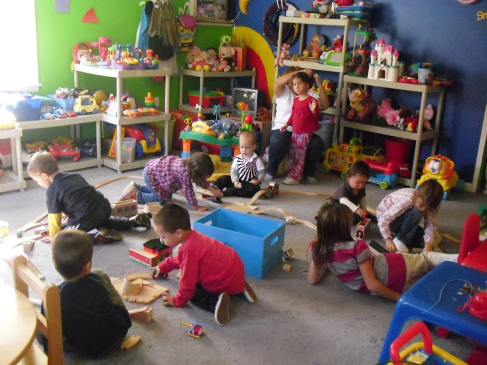 Children playing with toys in a classroom