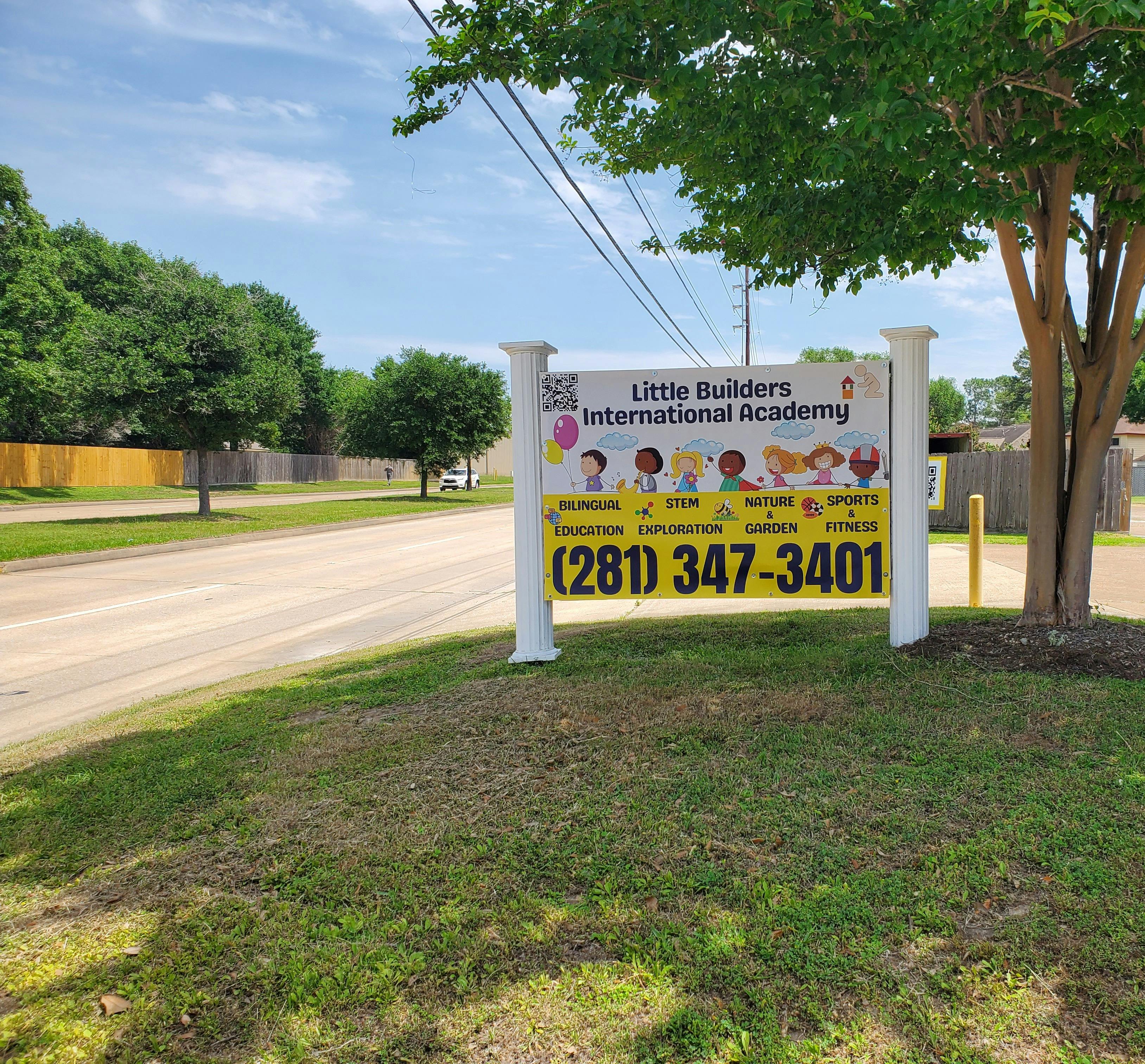 Little Builders International Academy sign by a road