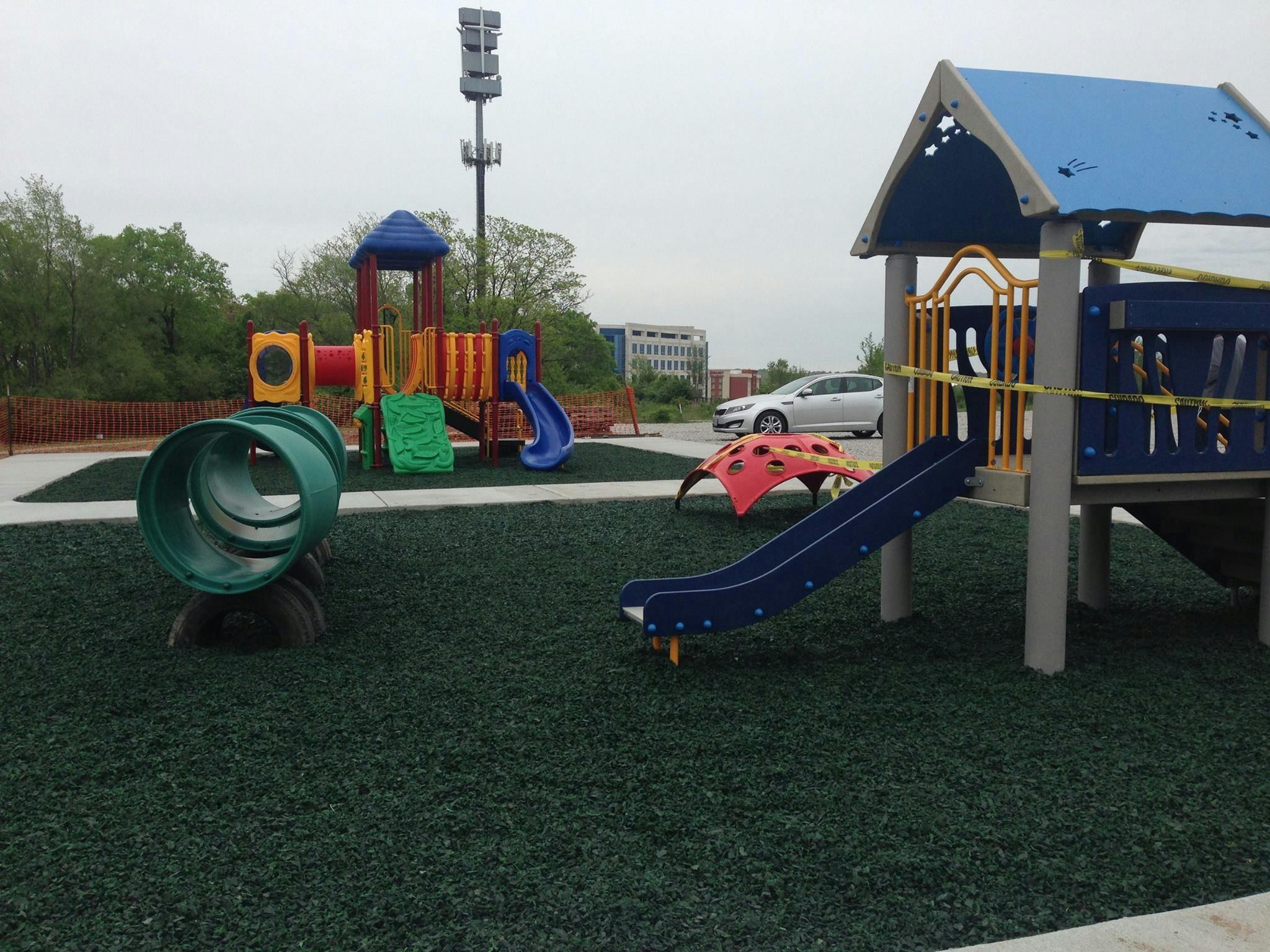 Playground with multiple slides and climbing structures