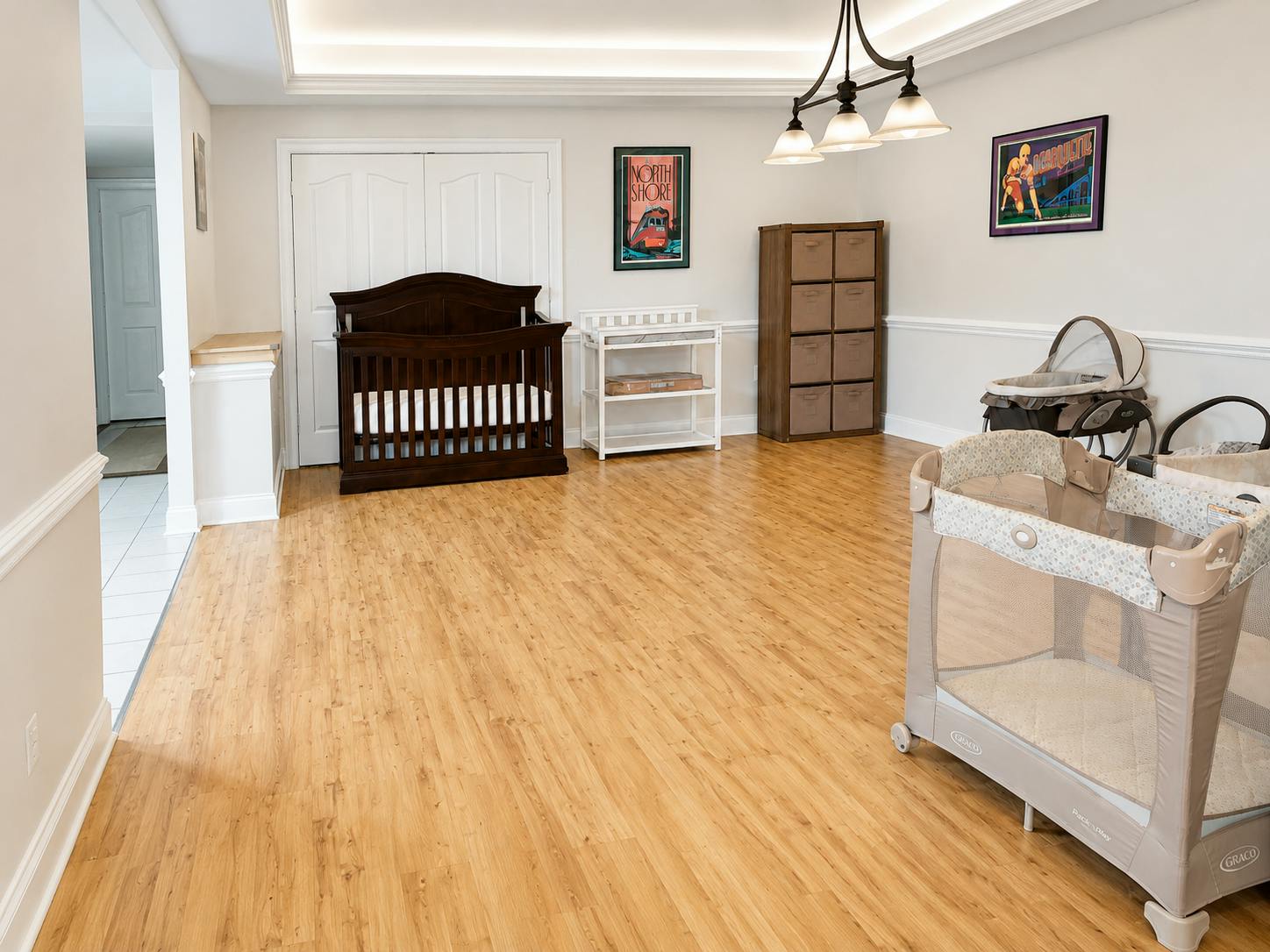 Spacious room with a baby crib and playard