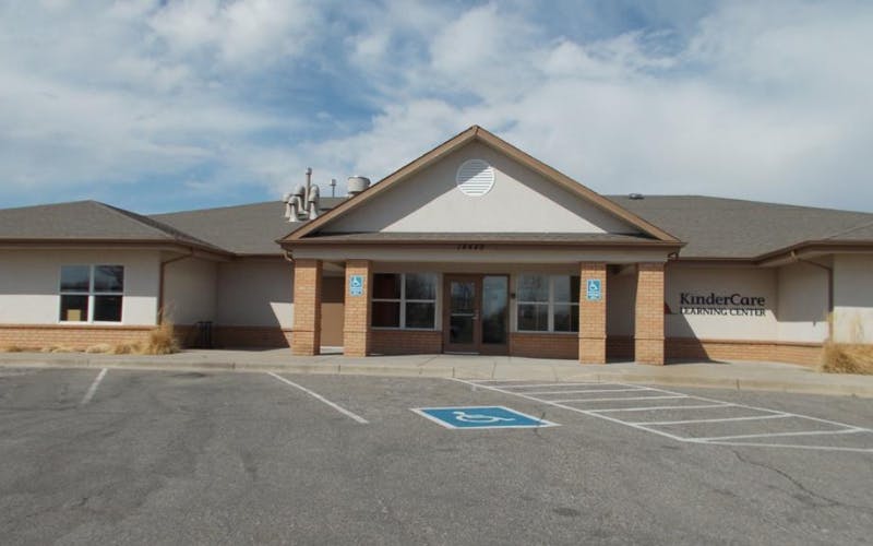 KinderCare Learning Center building exterior with a handicapped parking space