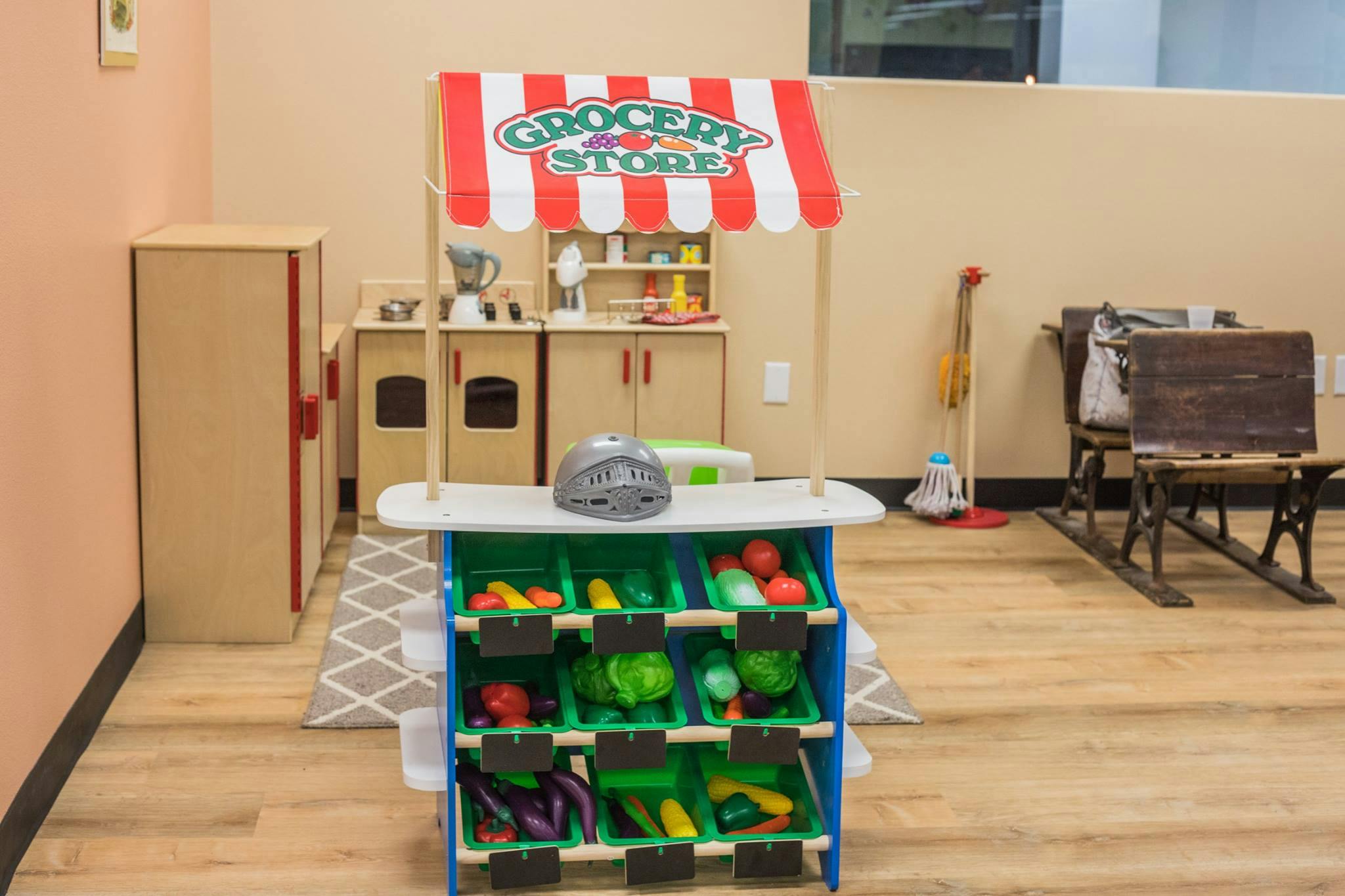 Play grocery store with toy fruits and vegetables