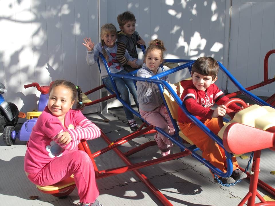 Children playing on playground equipment