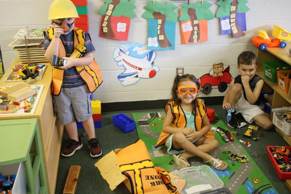 Children playing with toys in a classroom