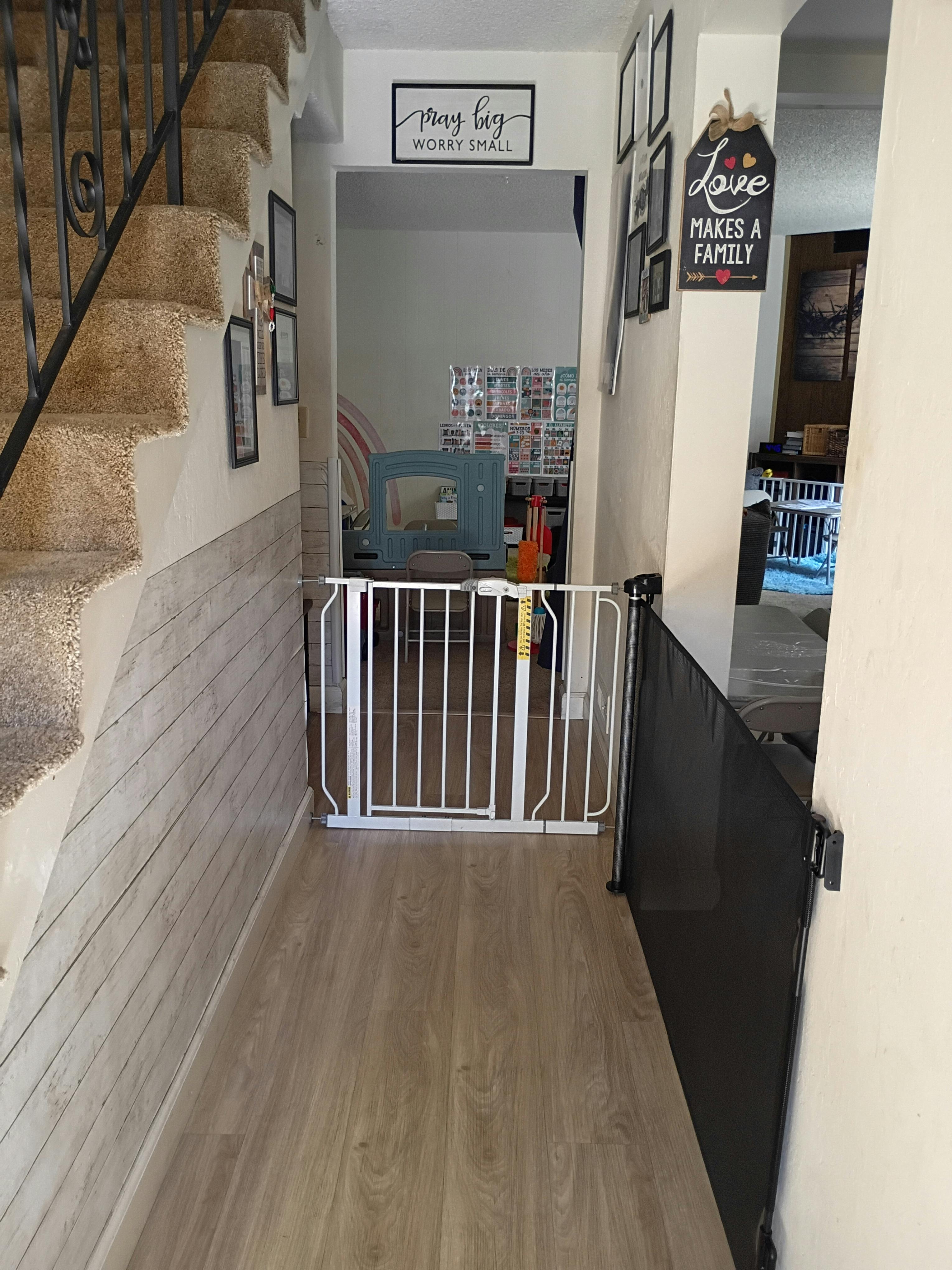 Child safety gate installed in a doorway