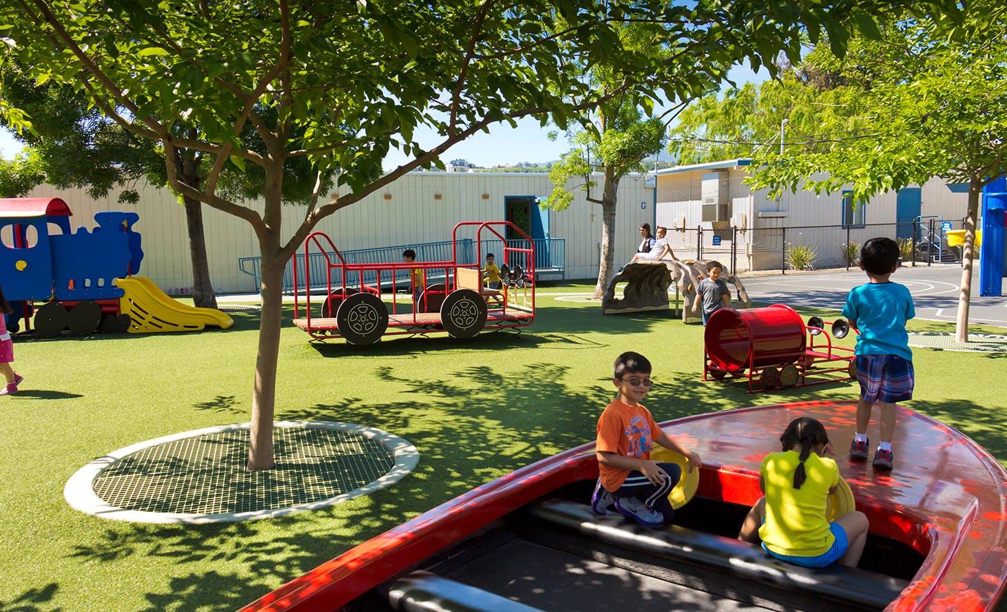 Children playing on playground equipment outdoors
