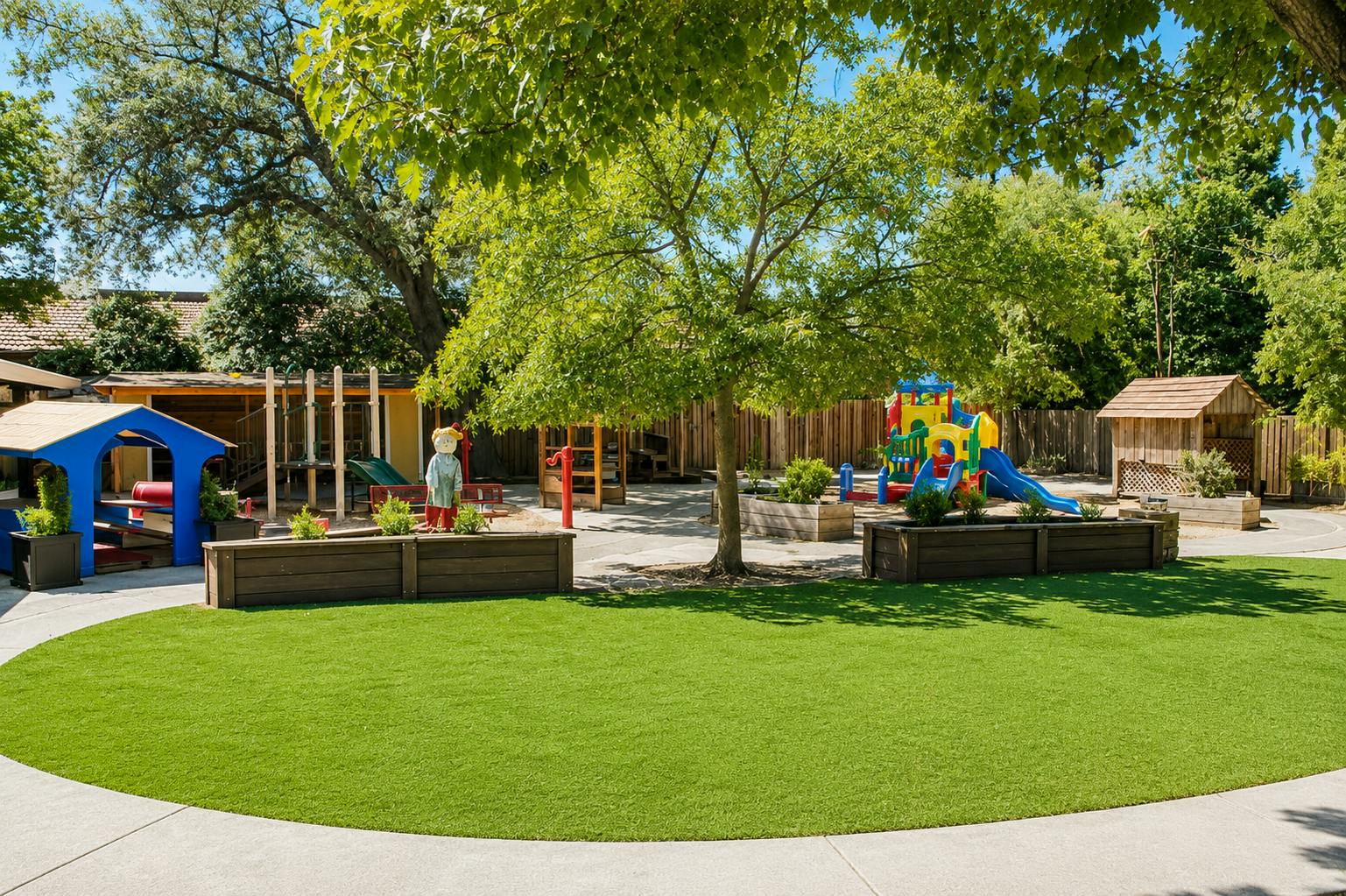 Playground with climbing structures, slides, and grassy area