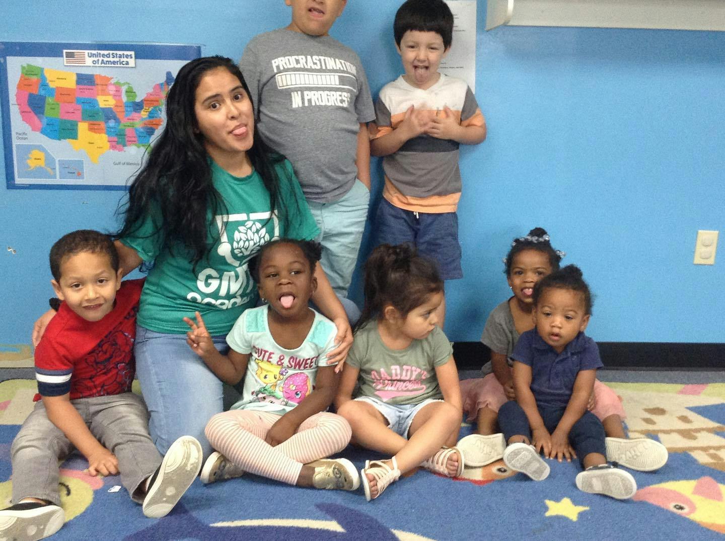 Adults and children posing for a photo