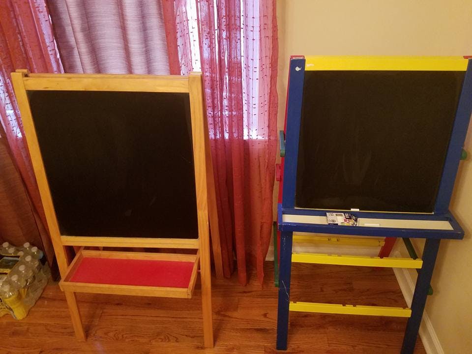 Two easels with chalkboards