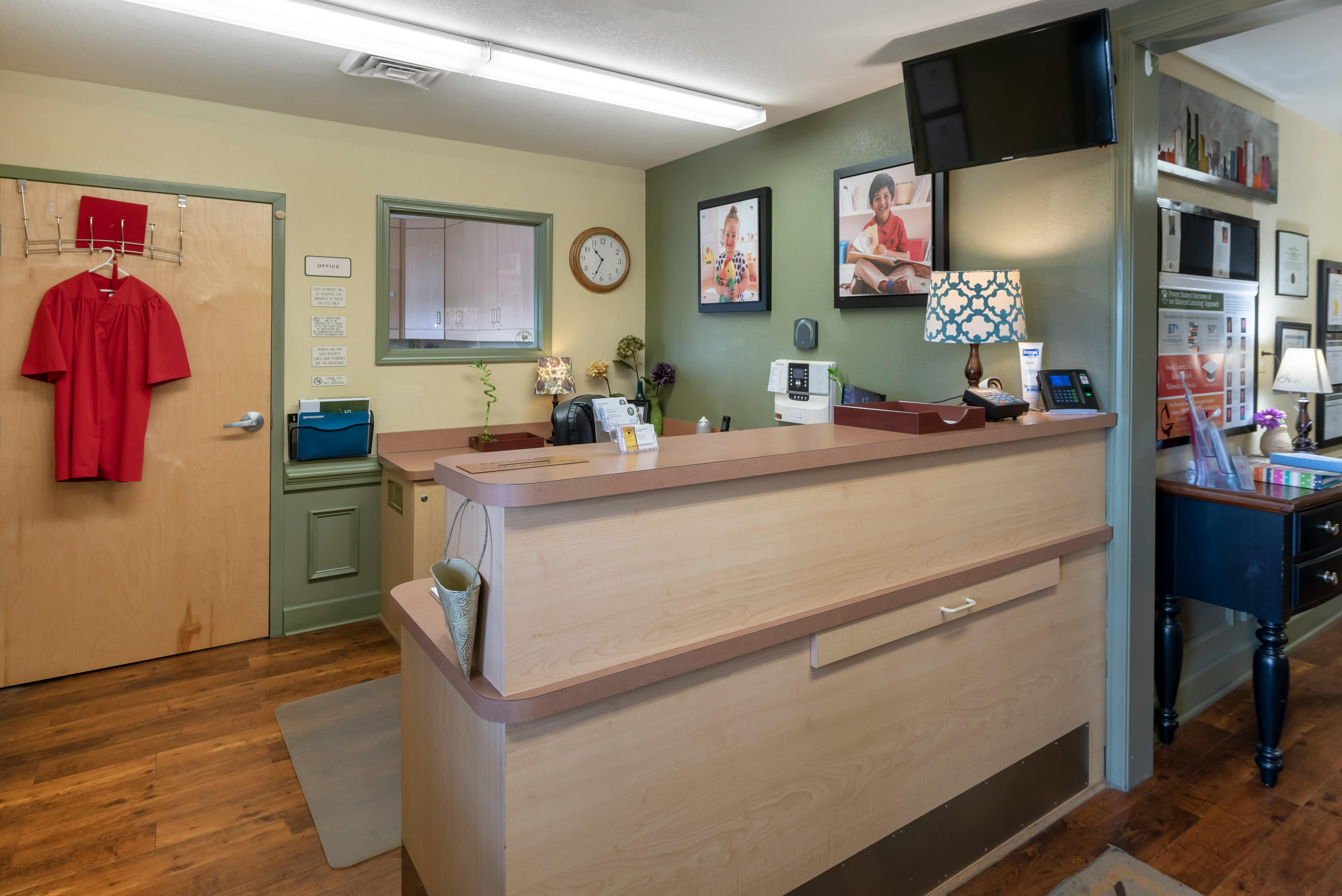 reception desk in an office with wall art