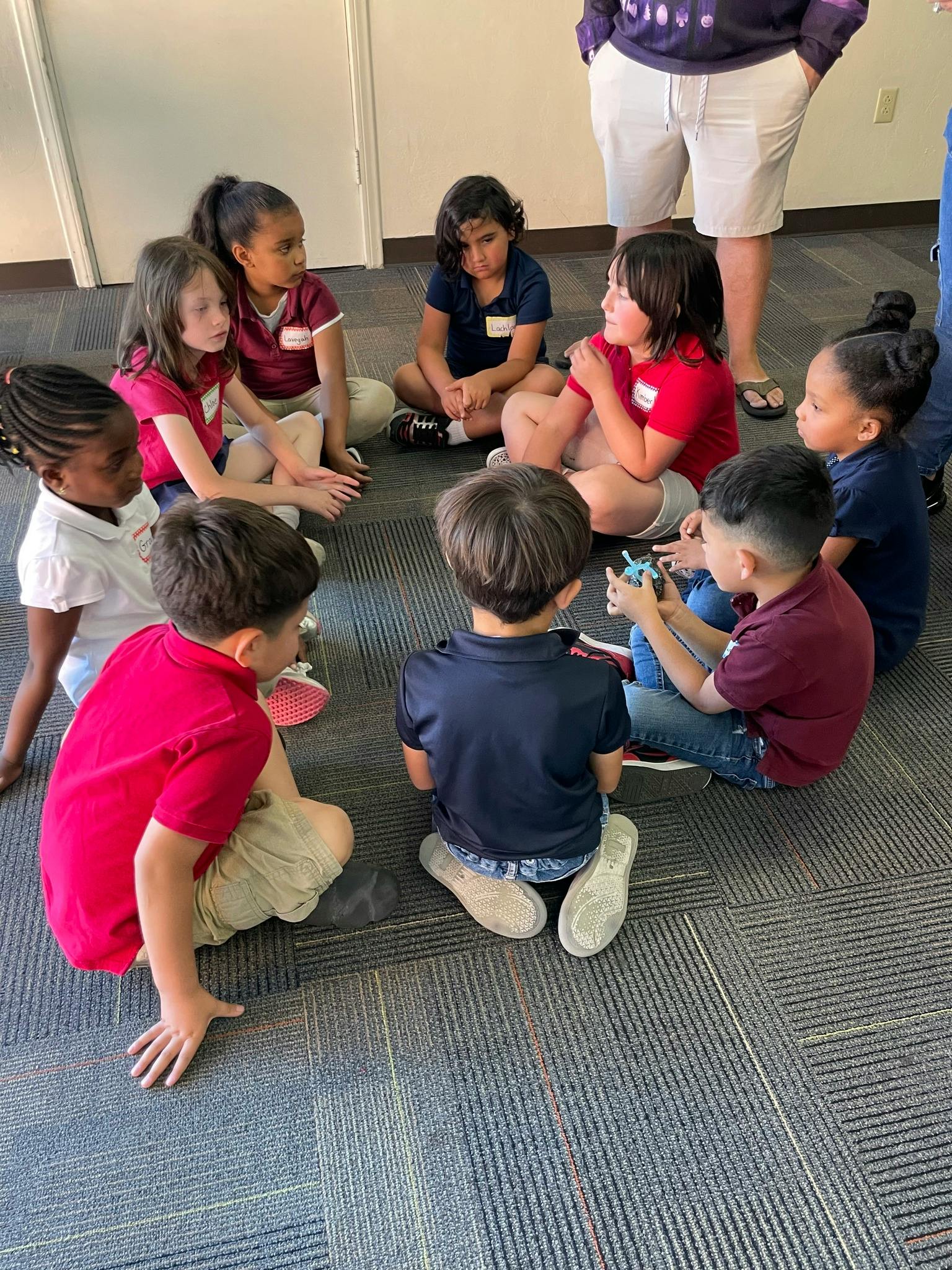 Children sitting in a circle on the floor