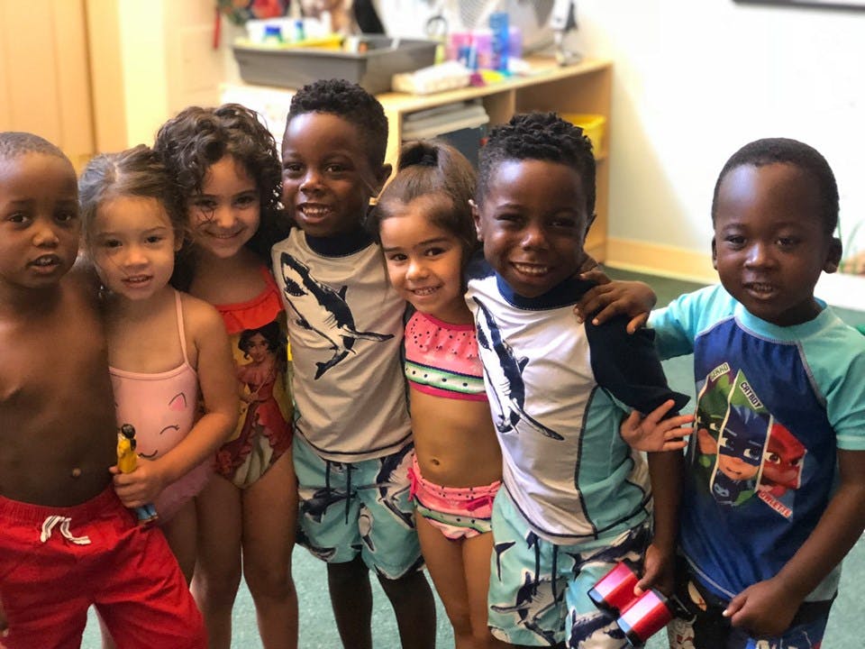 Group of children in swimsuits standing together