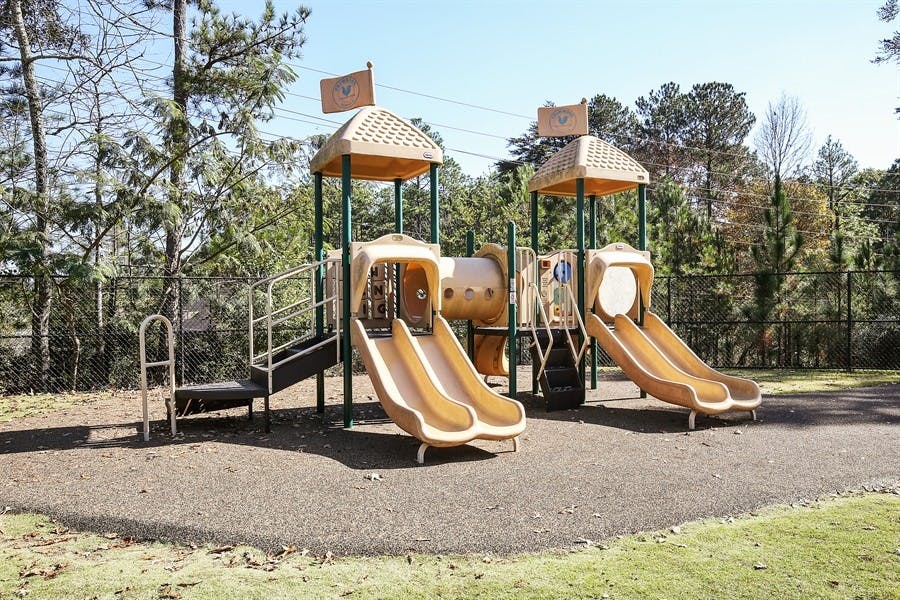 Playground with two slides and climbing structures