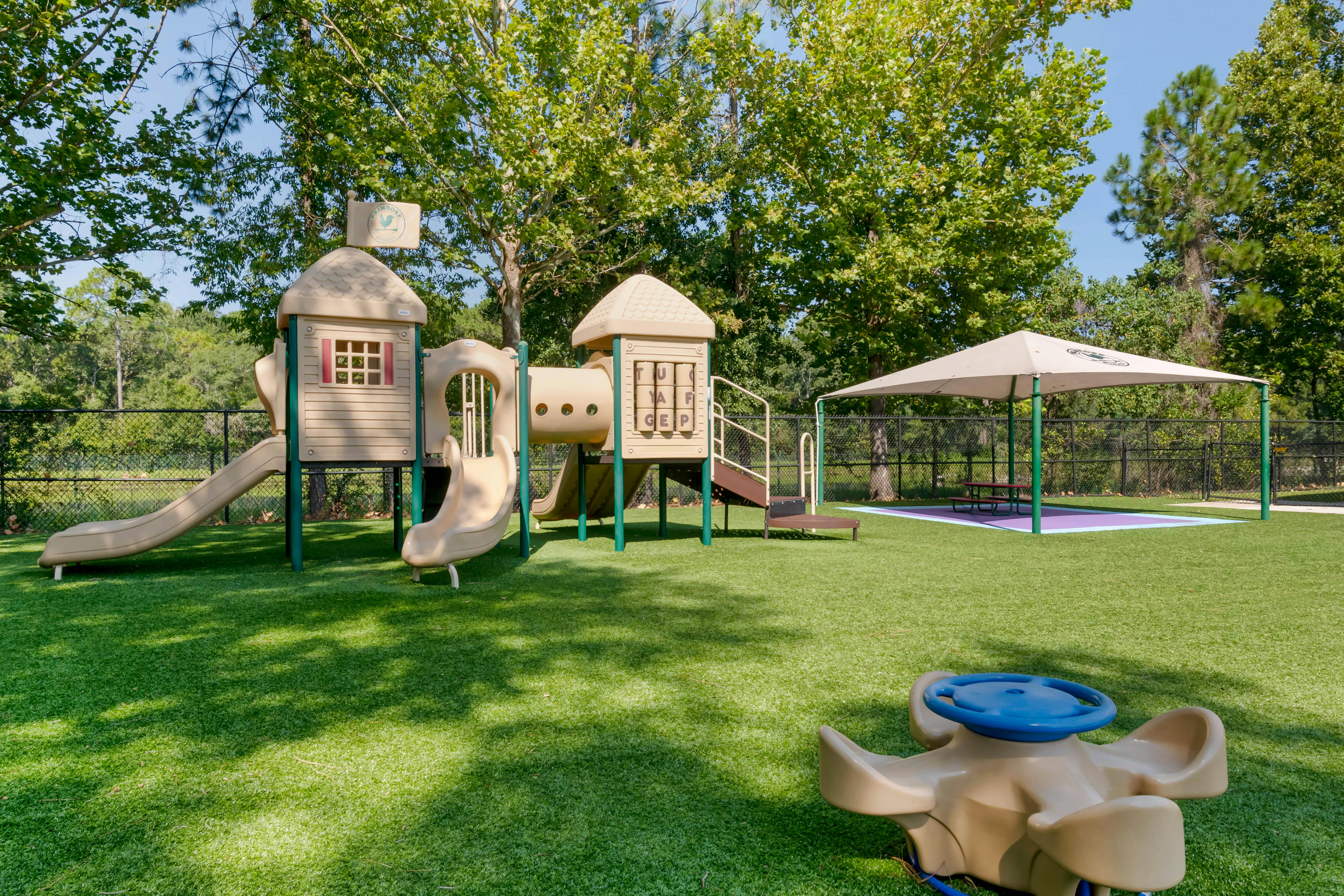 Playground with slides, tunnels, and a shaded picnic area