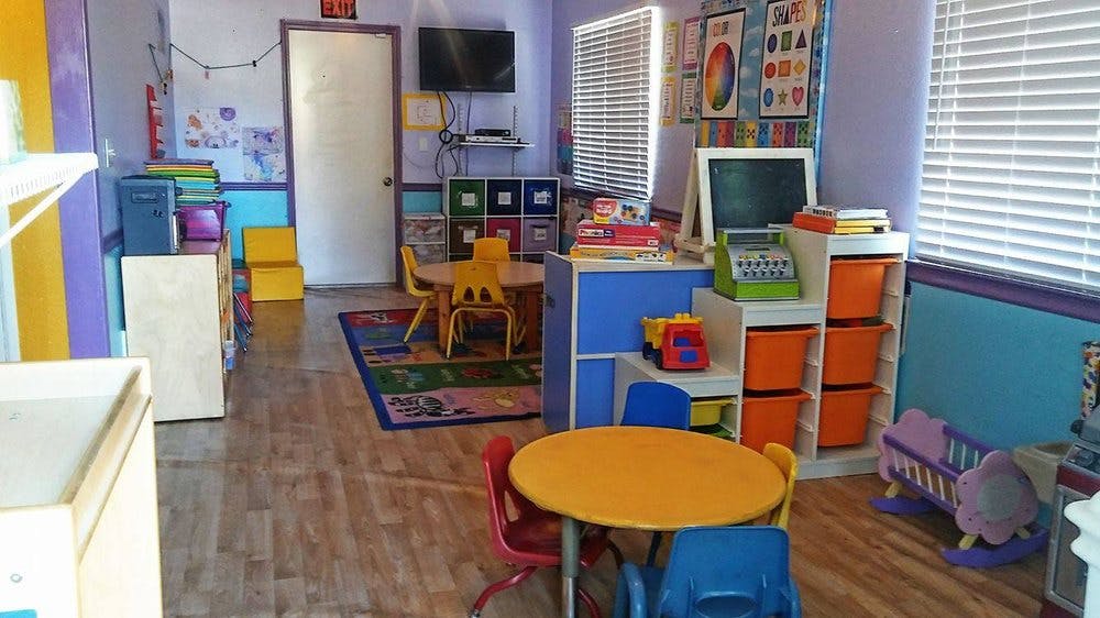 Playroom with small tables and chairs