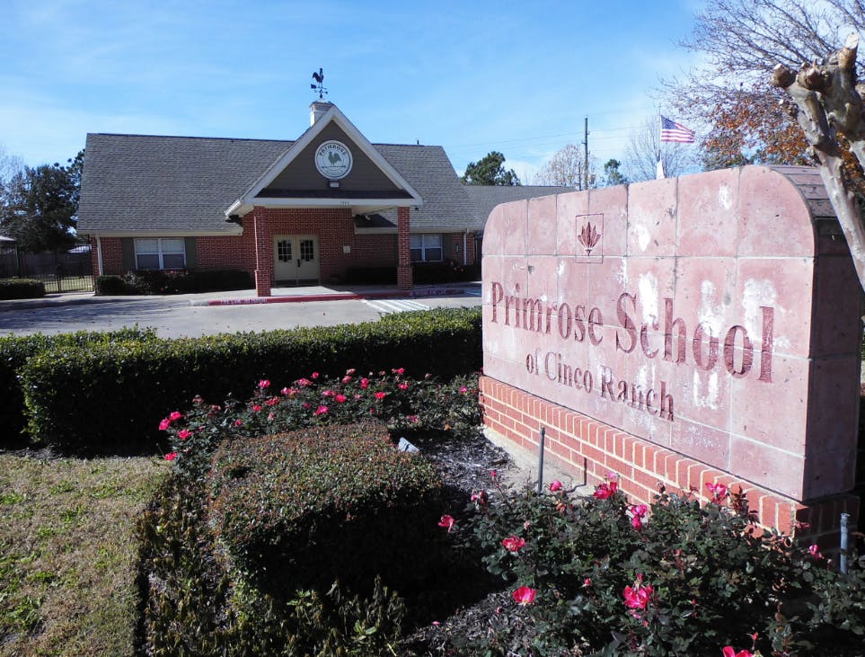 Primrose School at Cinco Ranch sign in front of a school building