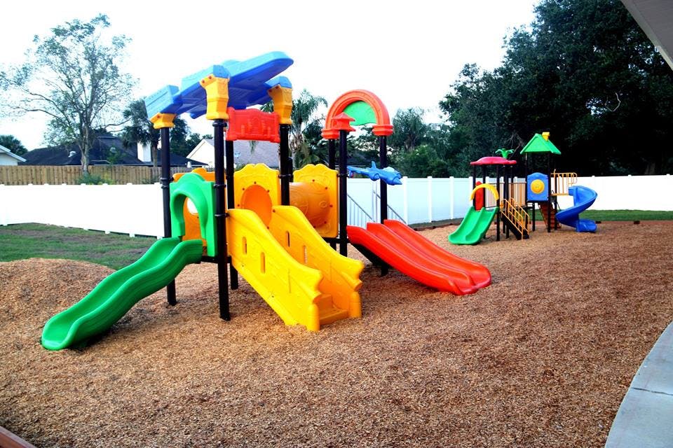 Playground with multiple slides and climbing structures