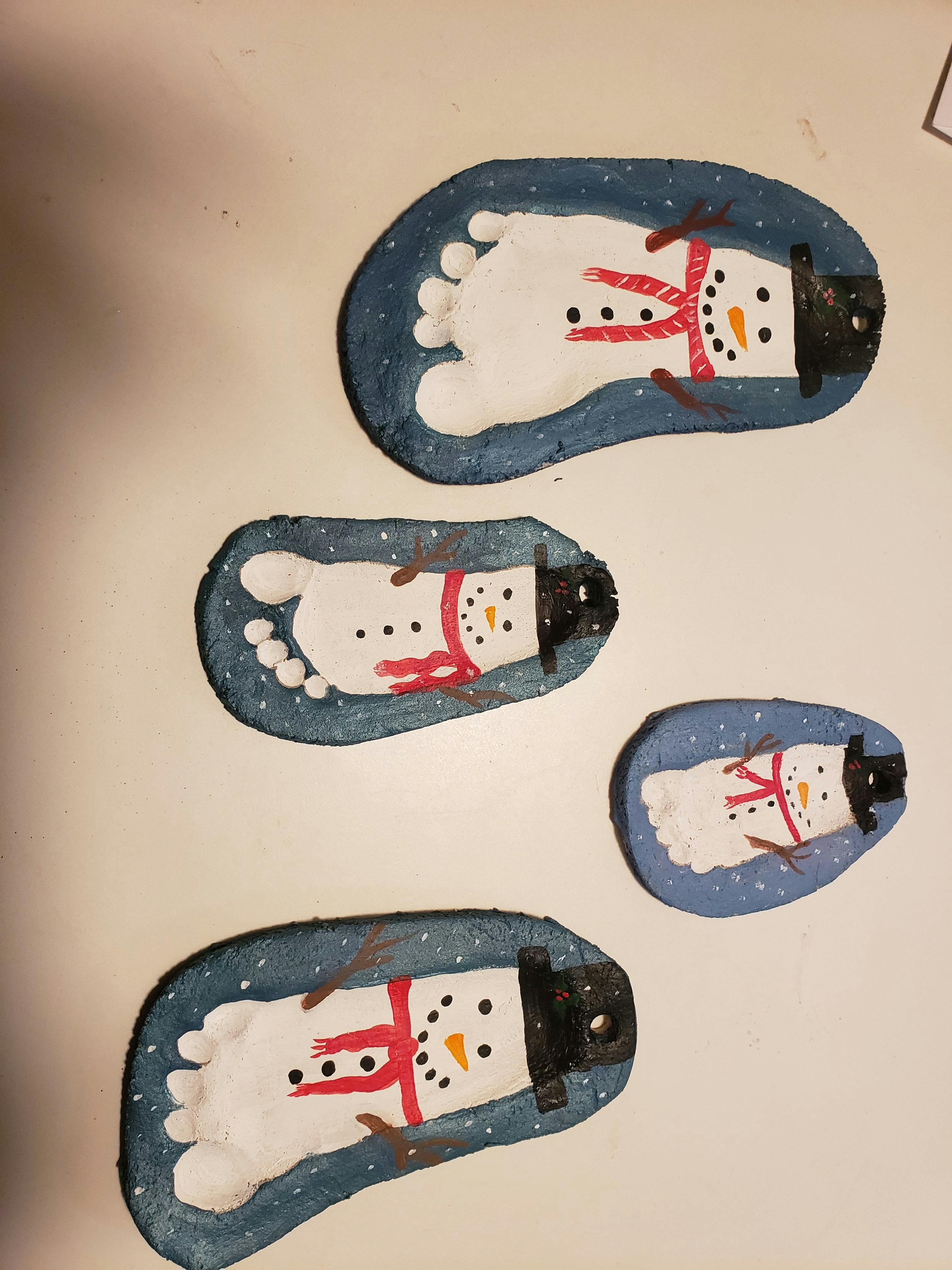 Multiple snowman foot print crafts