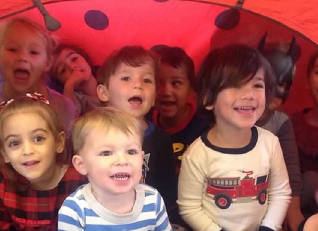 Group of children smiling and looking forward