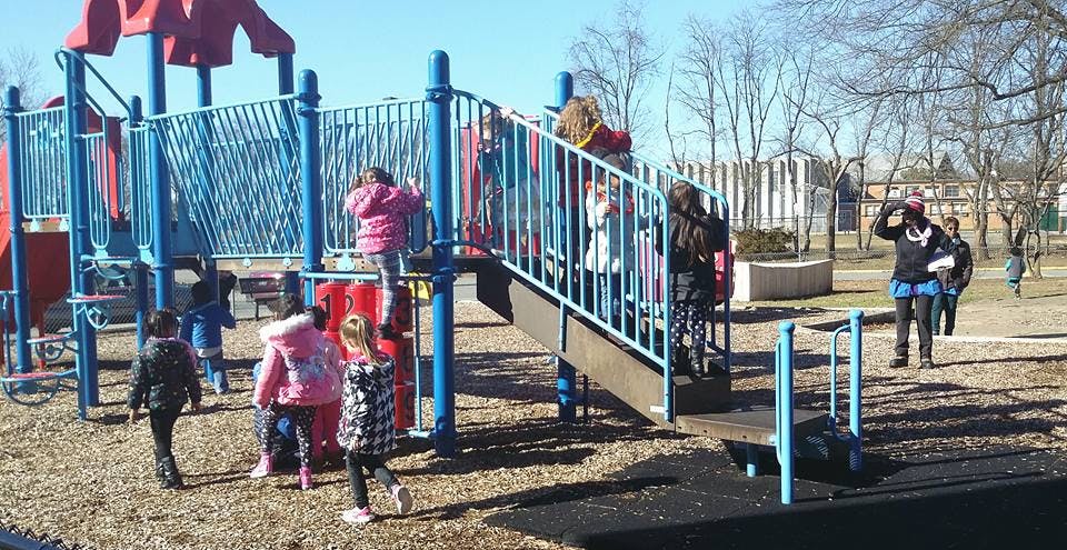 Children playing on a playground structure