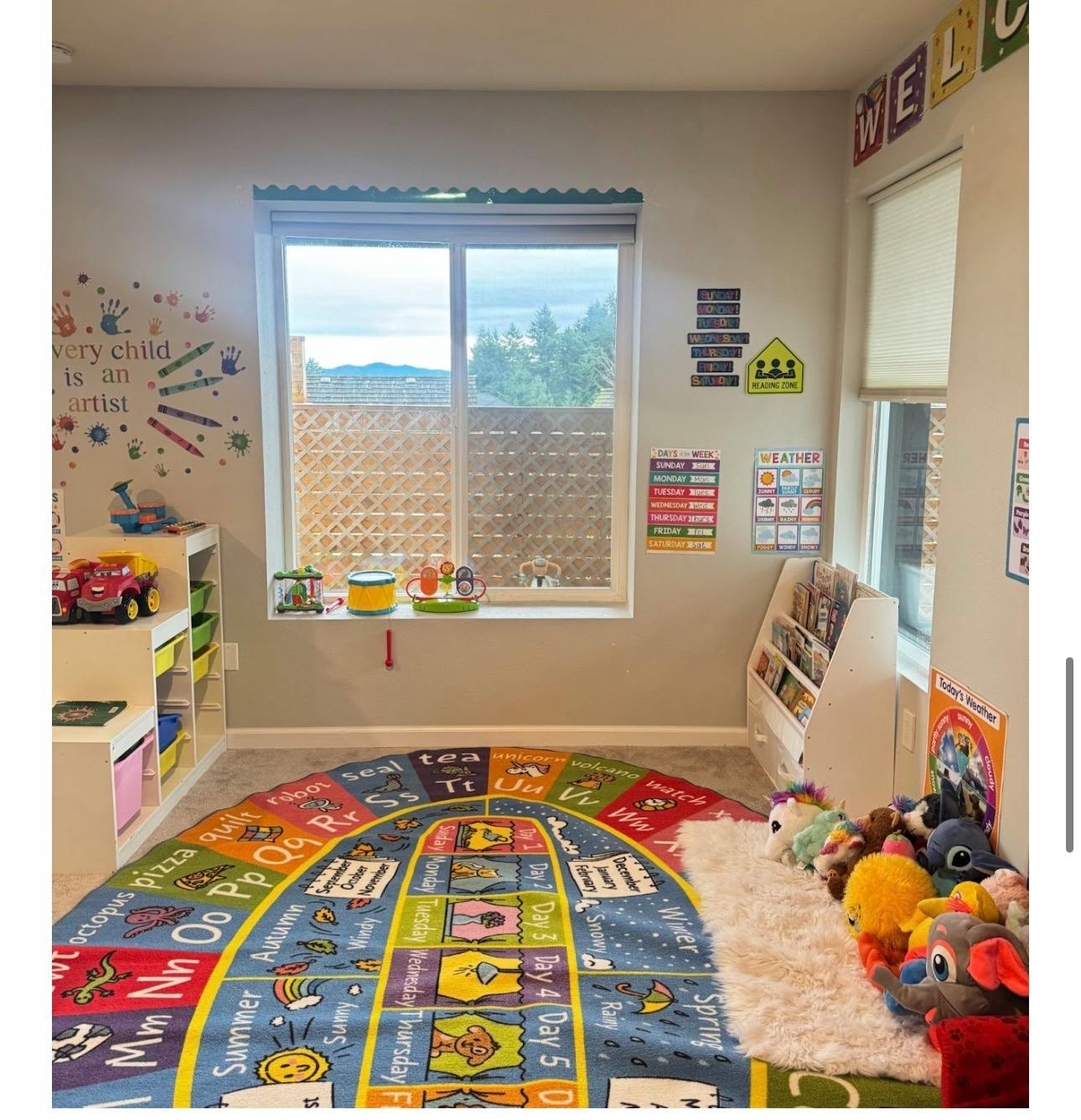 Colorful educational rug with letters and weather icons in a play area