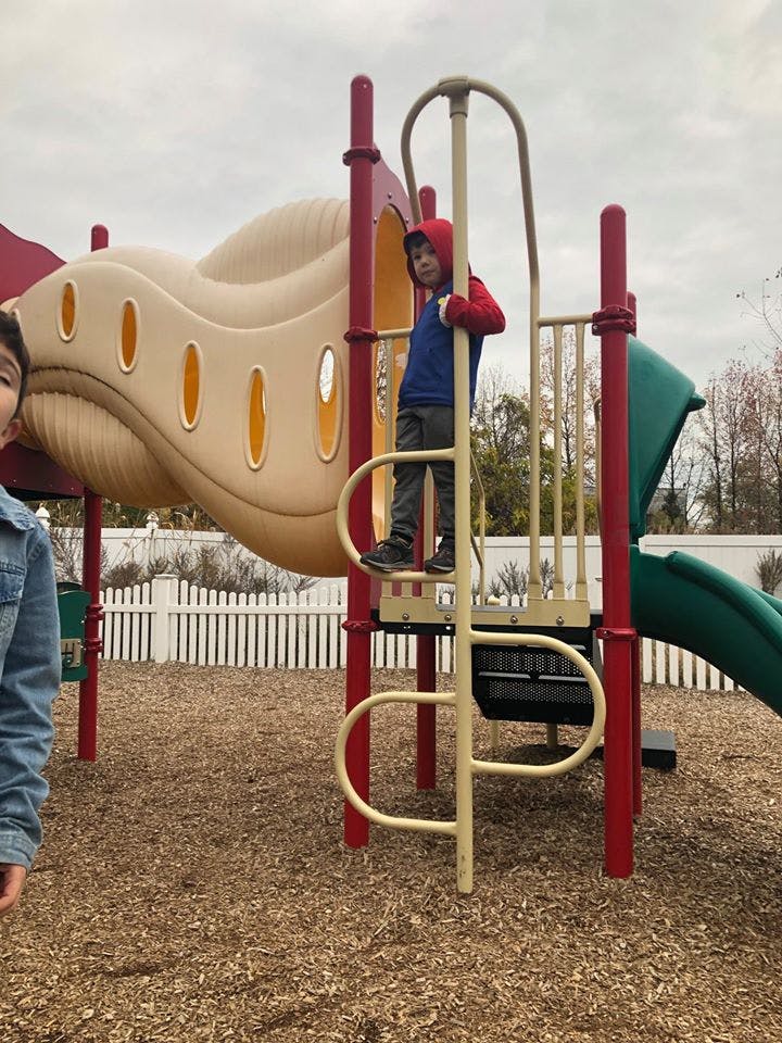 Child on a playground climbing structure