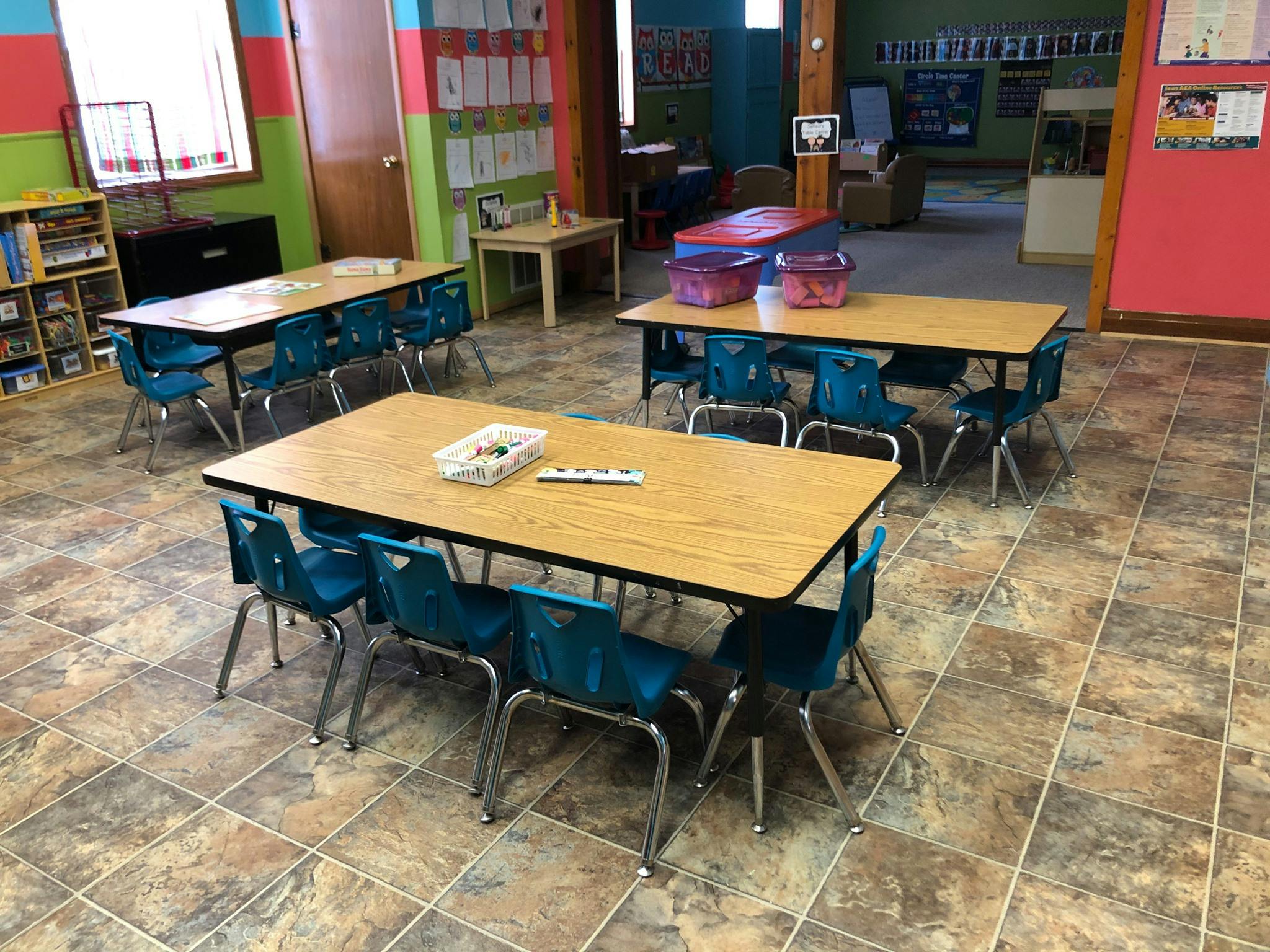 Classroom with multiple tables and chairs
