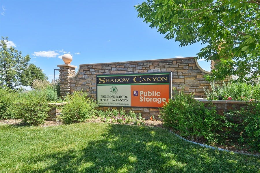Shadow Canyon Public Storage sign on a stone wall