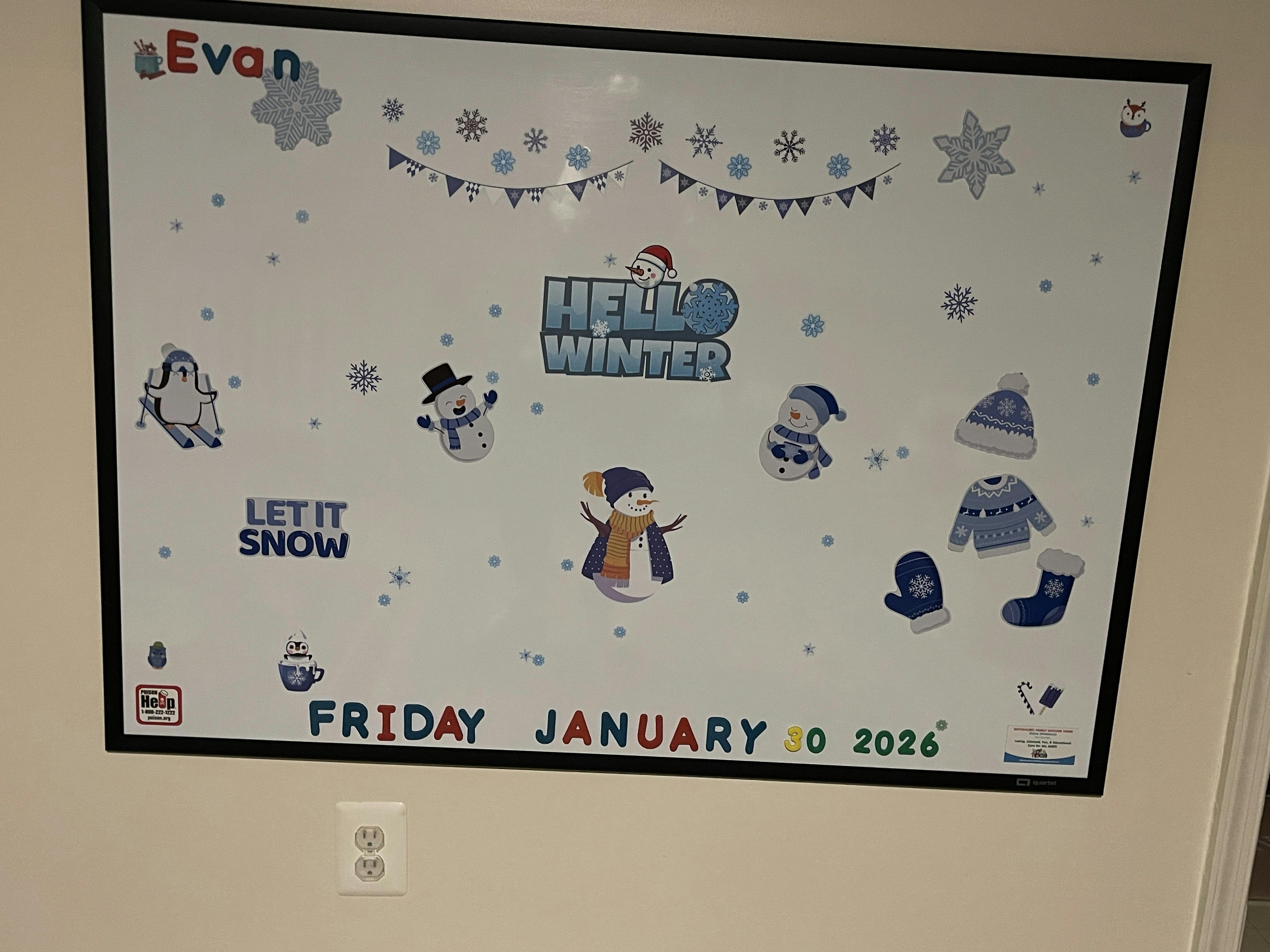 Whiteboard with winter-themed stickers and text "Evan," "Hello Winter," "Let it Snow," "Friday January 30 2026"
