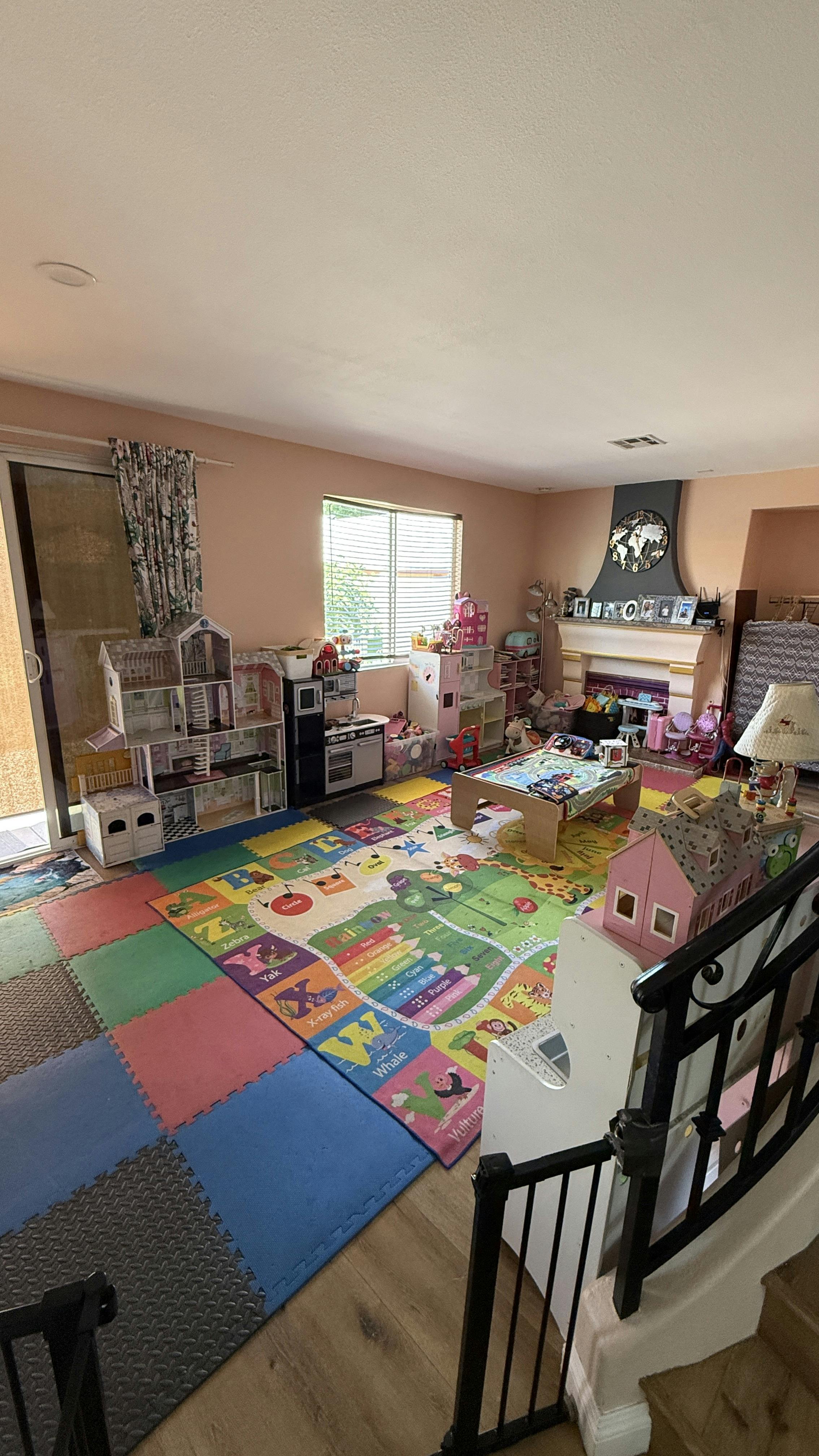 Playroom with floor mats and children's toys