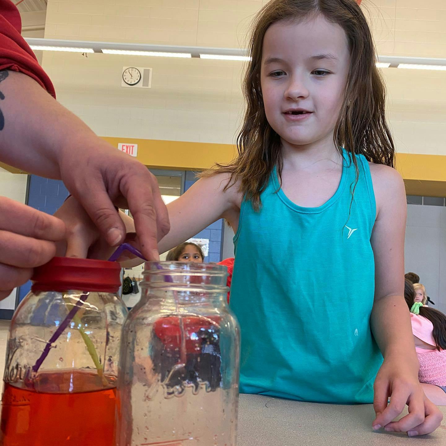 Person and child working with jars