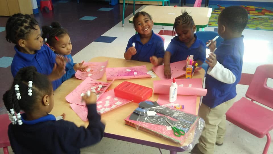 Children doing crafts at a table