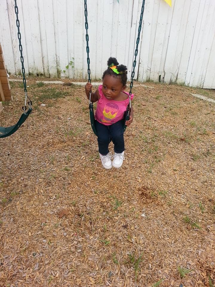 Child on a swing set